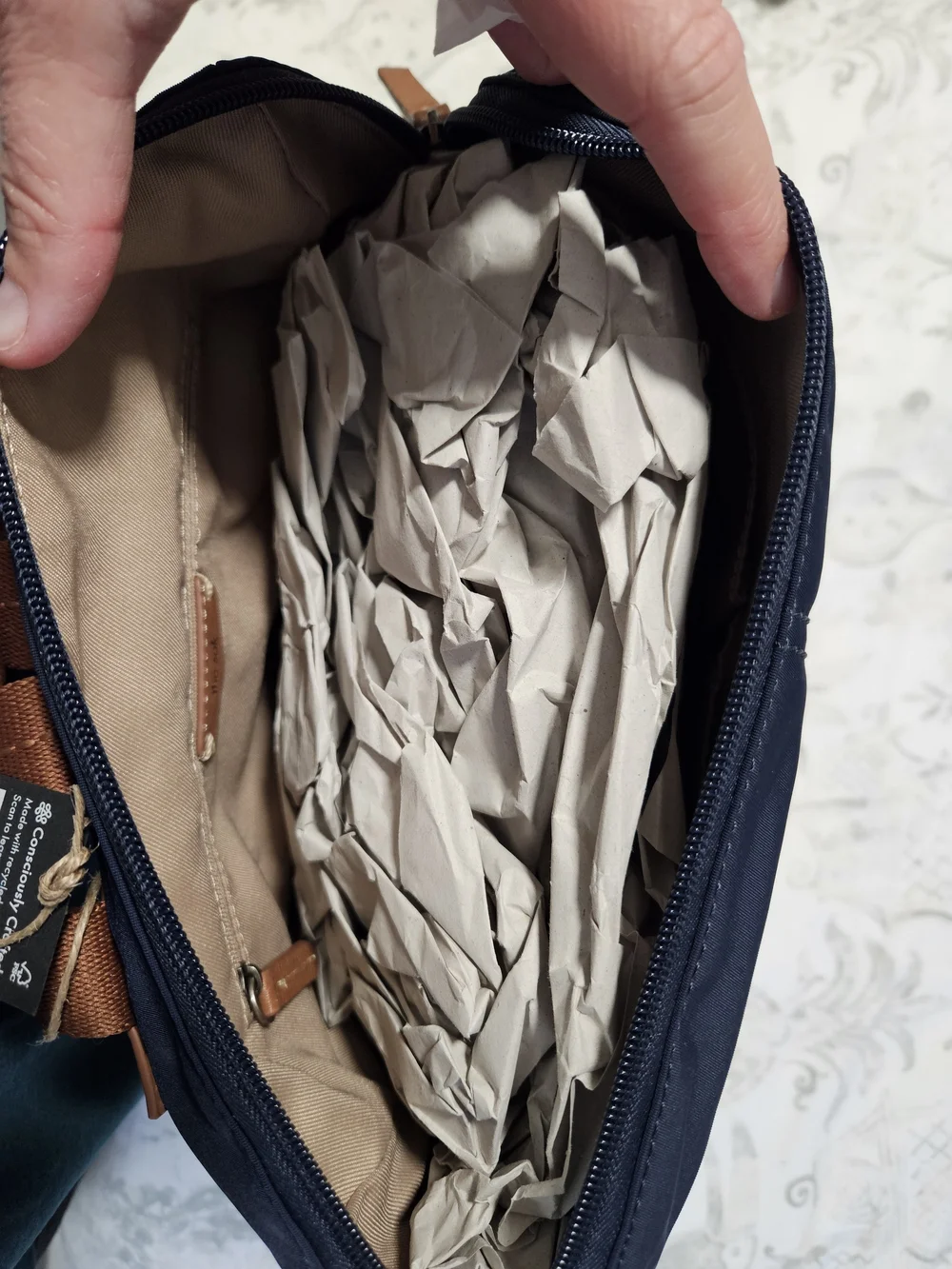 The Sak Navy Backpack with Brown Trim and Straps